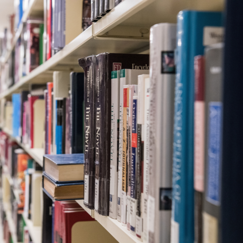 A shelf full of books in a campus library