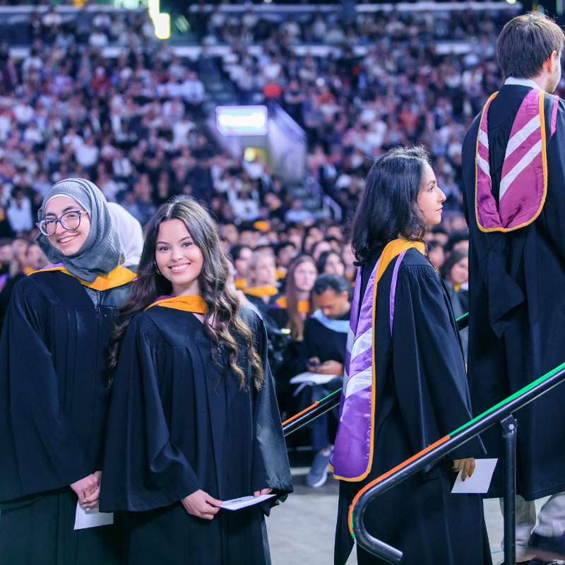 Grads walking across the stage at Canada Life Place