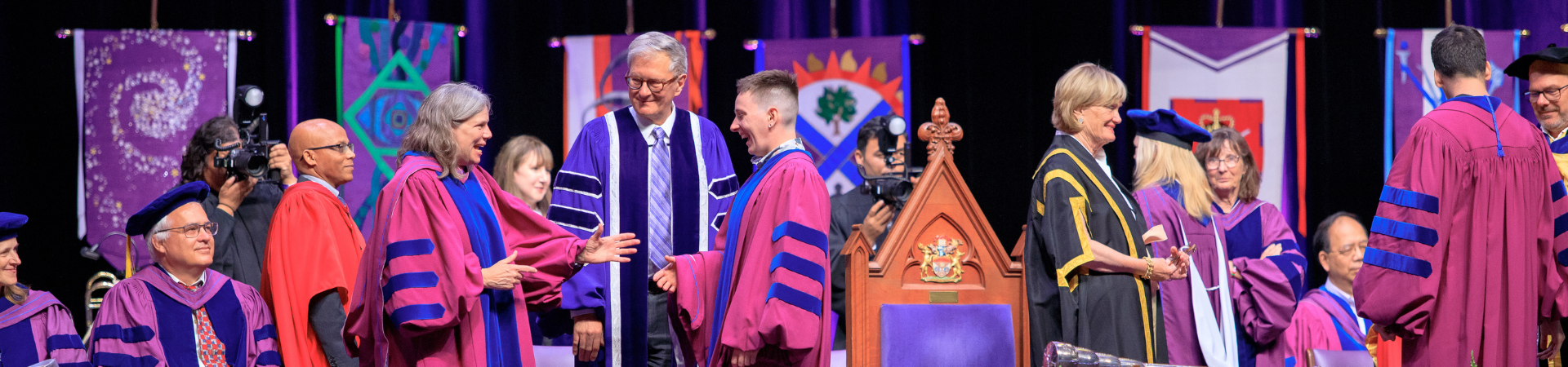 Graduates walking across the stage